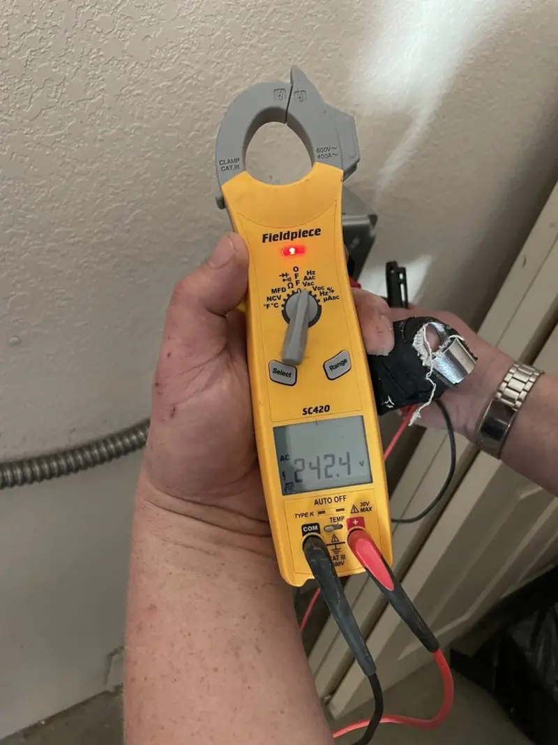 Voltage testing with clamp meter during Generator Installation in Marco Island